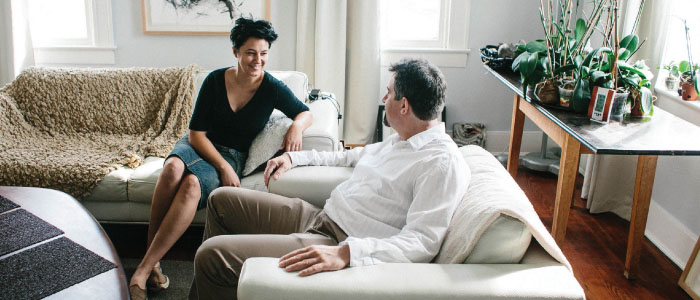 Couple sitting in living room